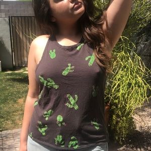 Faded black tank top with graphic cactuses on it